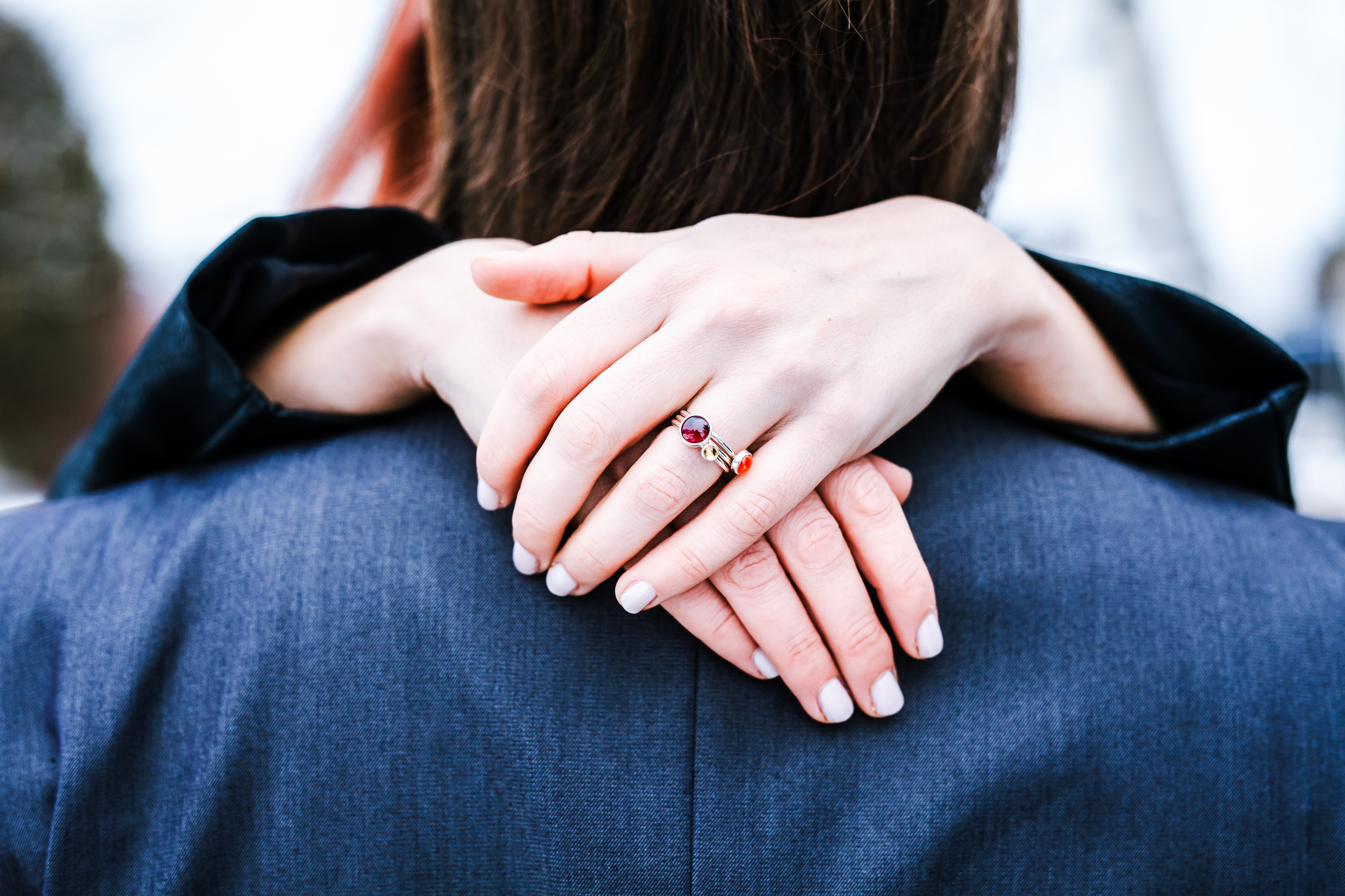 Hands around someone in an embrace