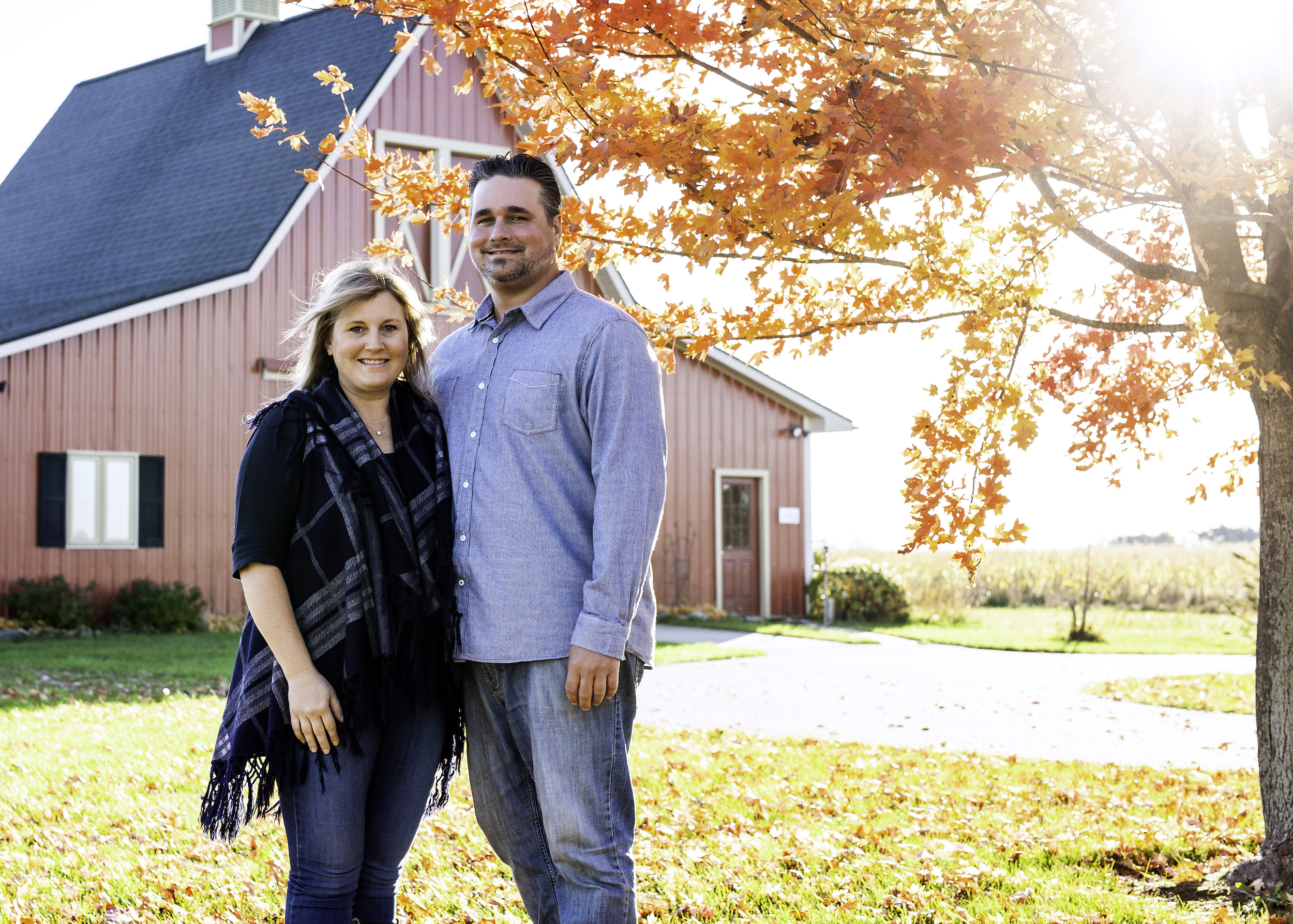 Portrait of a couple under a red tree