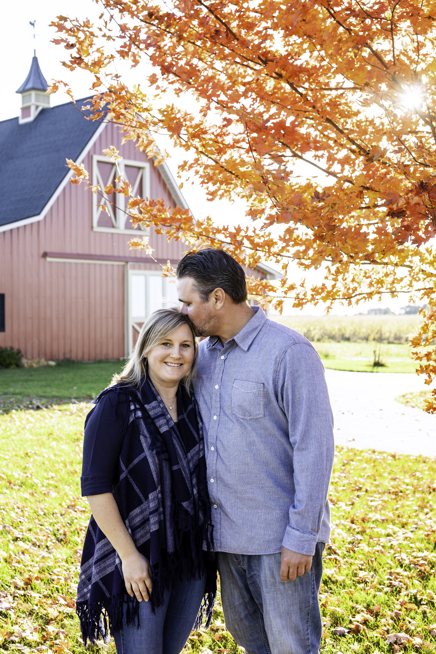 Couple kissing under a tree