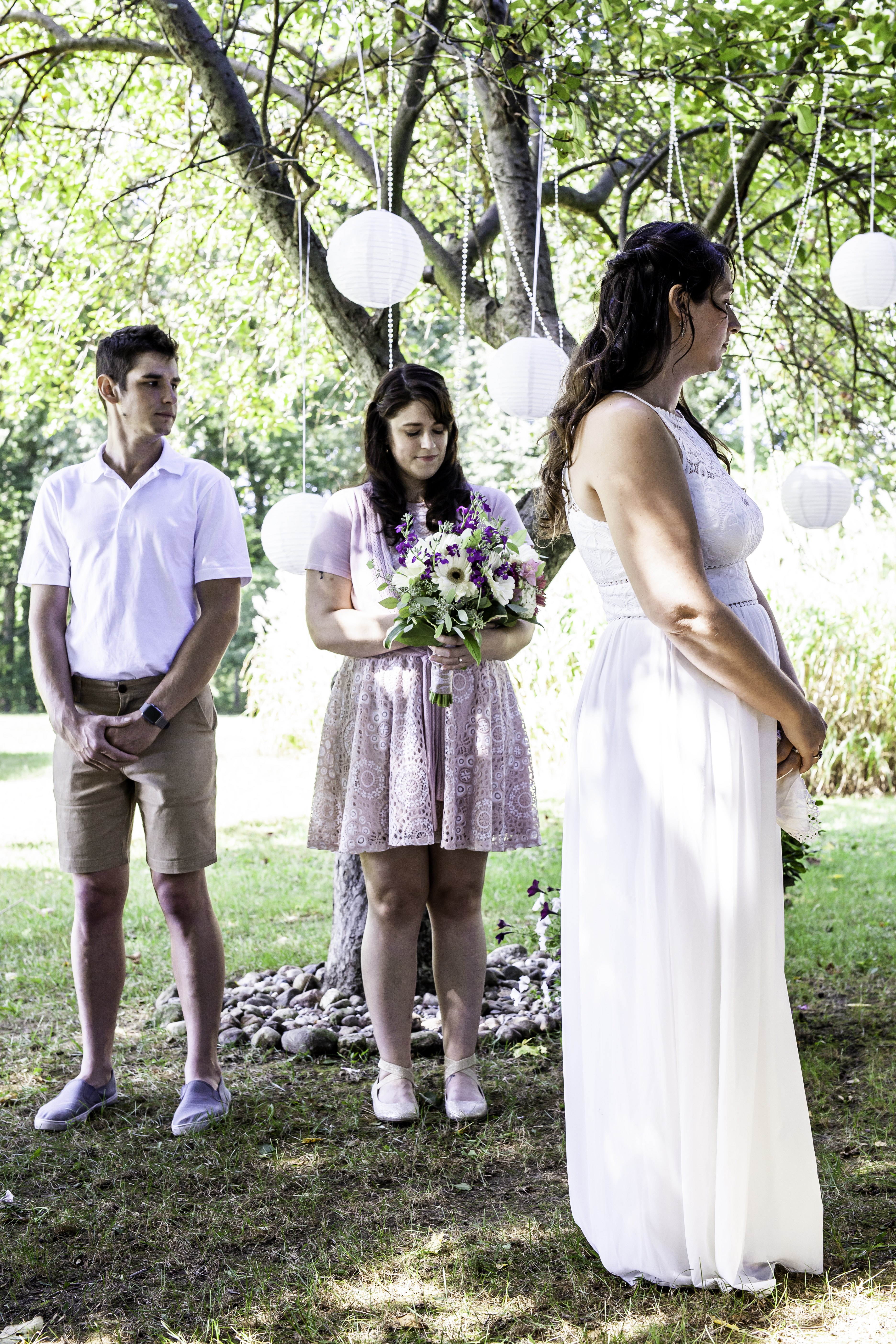 Wedding party standing during the ceremony