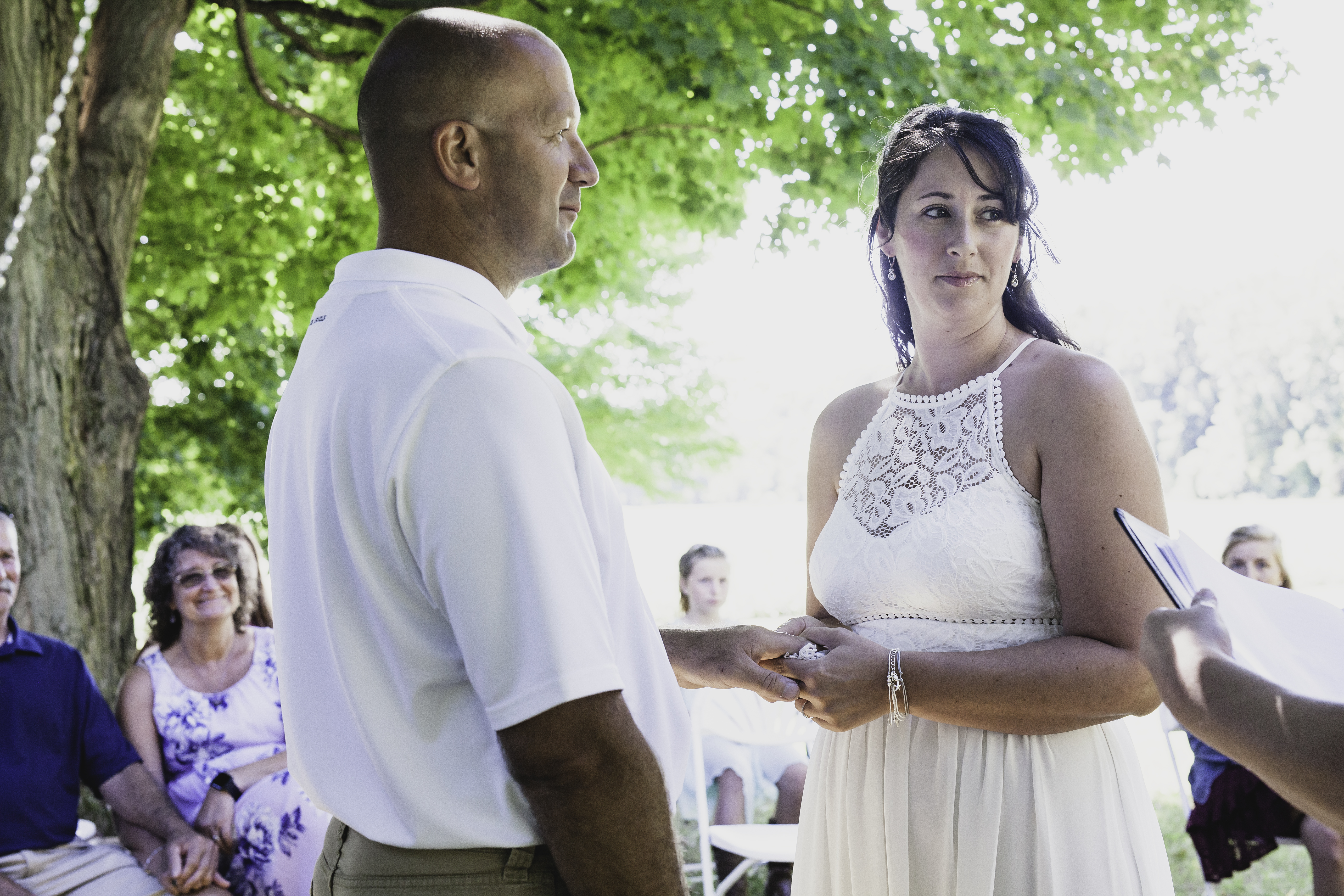 Couple holding hands during the ceremony