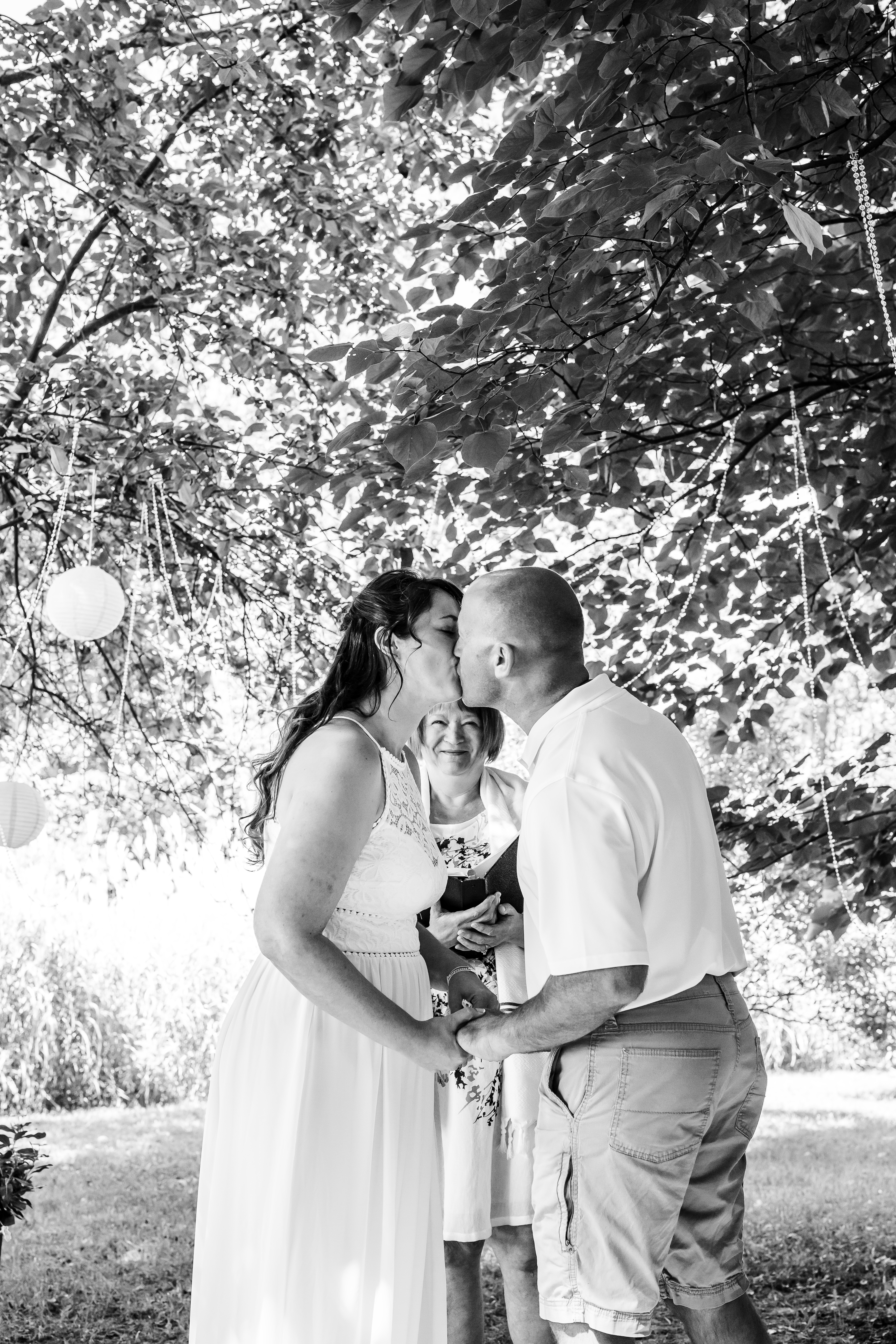 Couple kissing during wedding ceremony