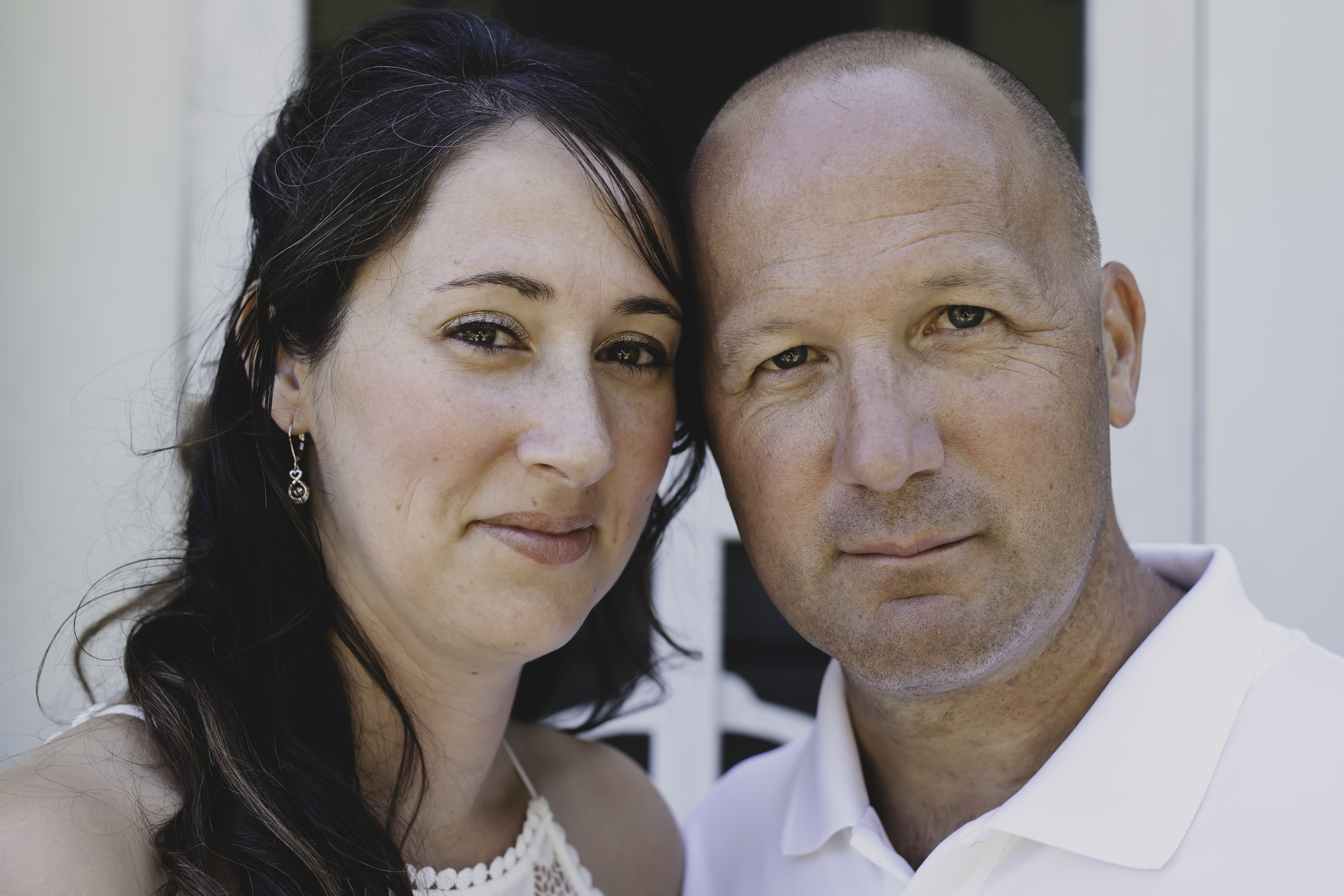 Couple smiling together at camera