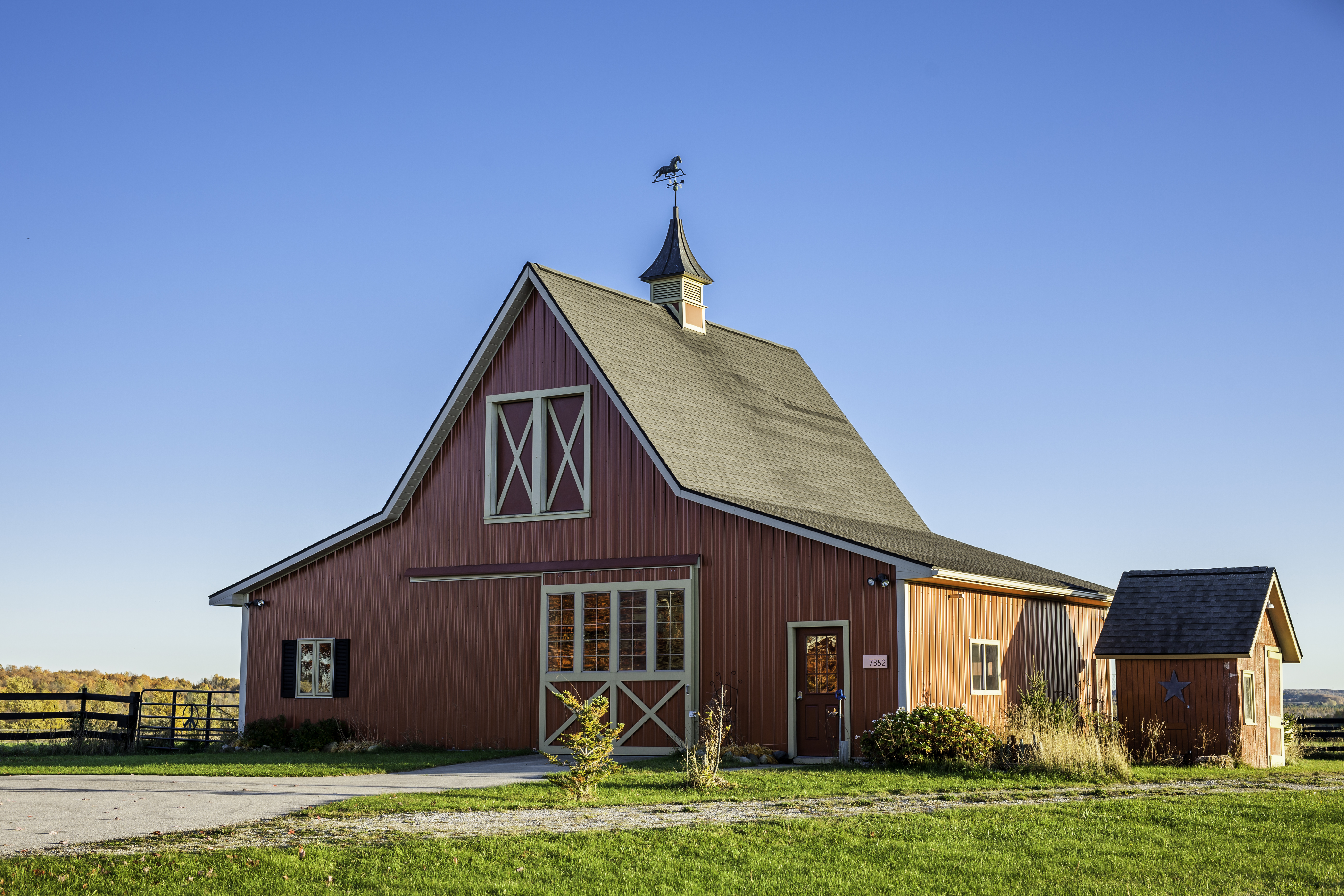 Red barn against a blue sky
