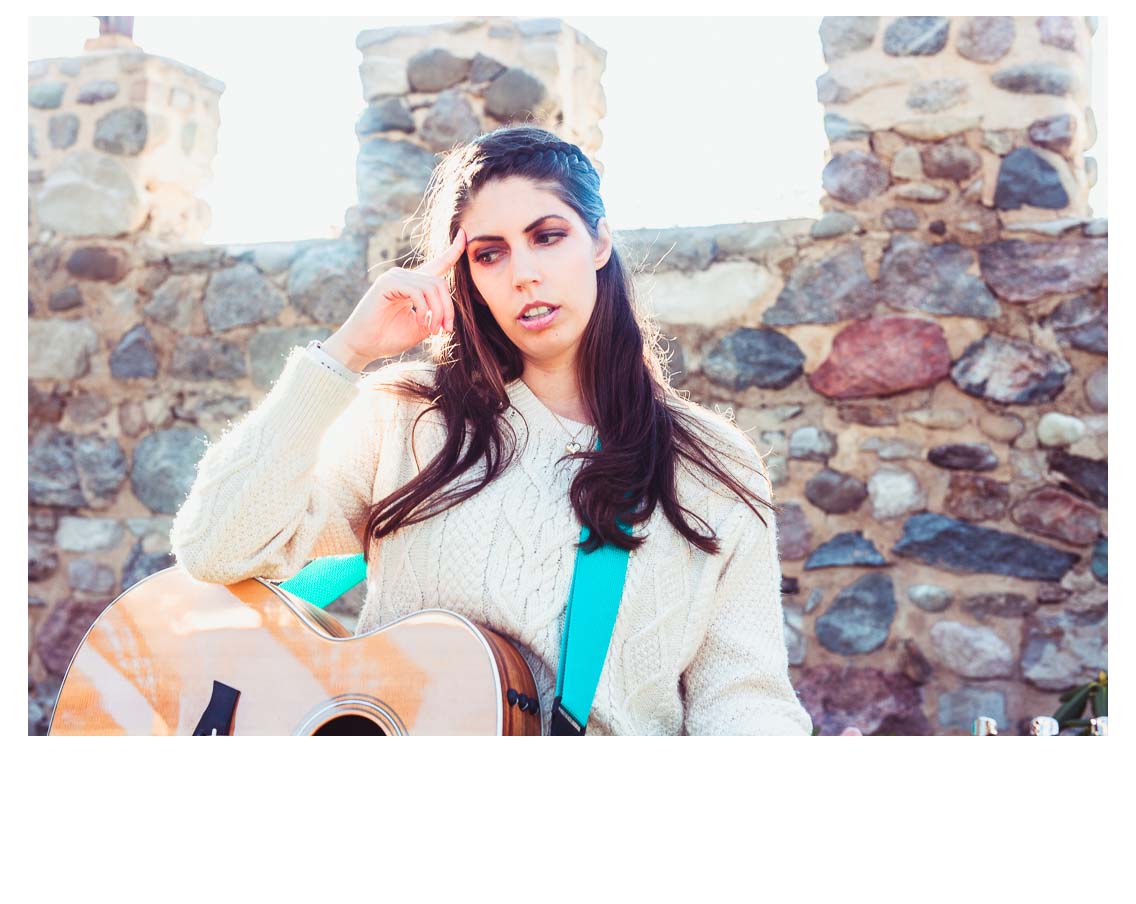 Music Teacher thinking with her guitar