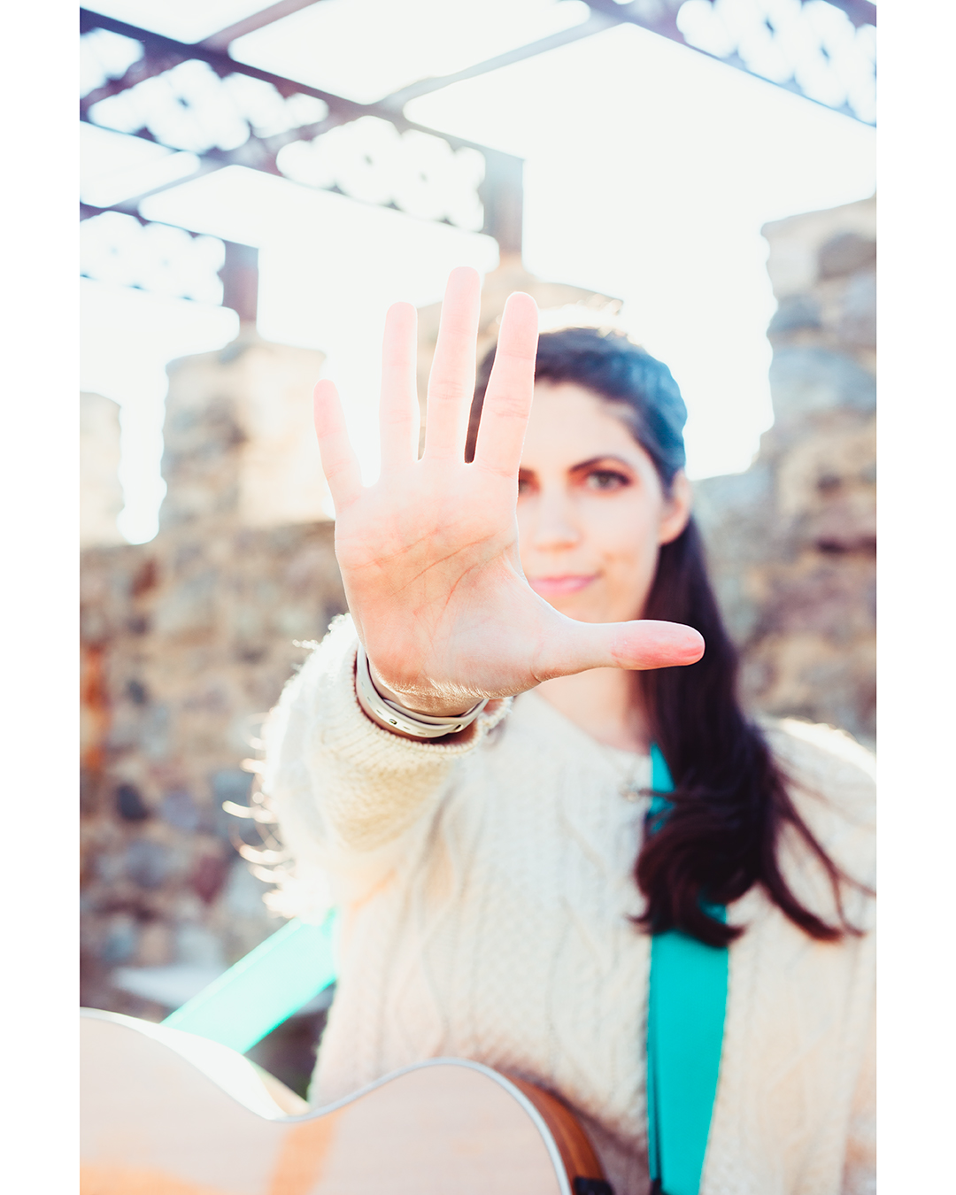 Music Teacher holding hand out in front of her face