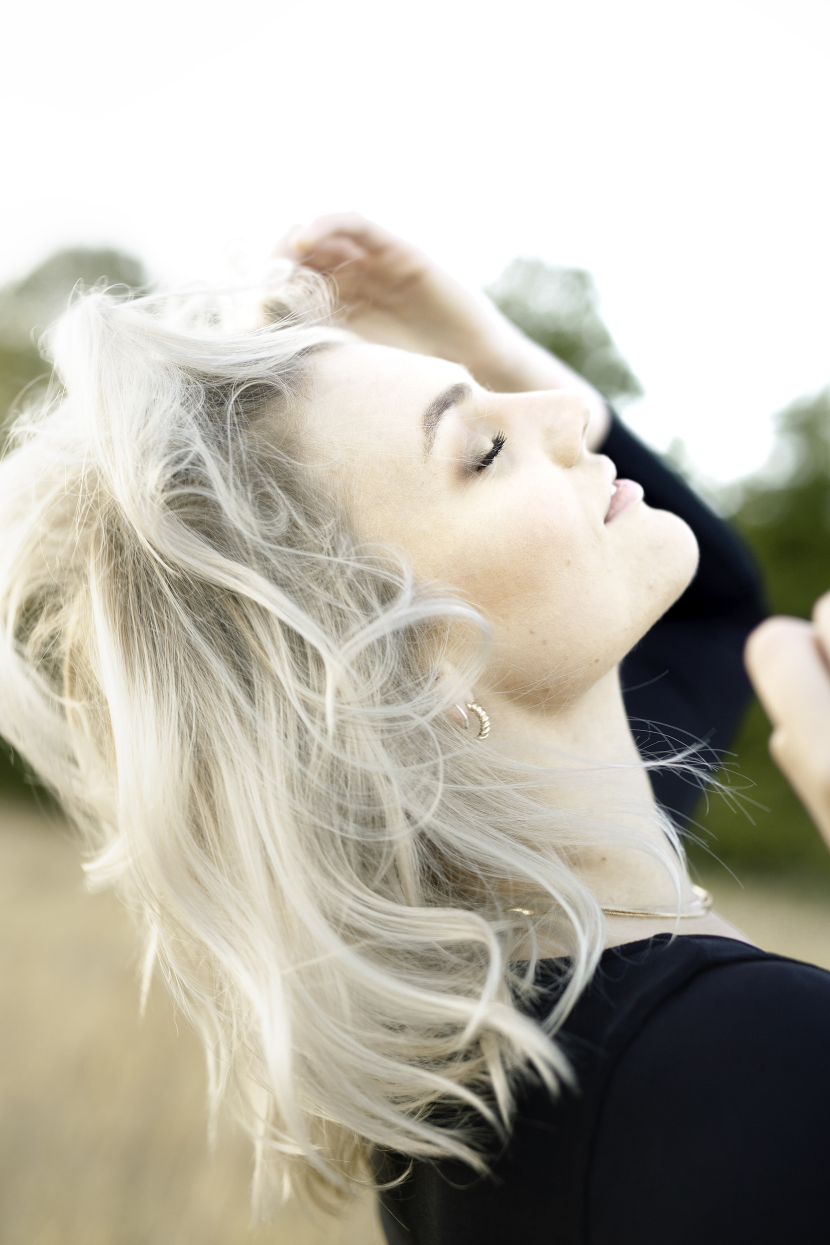 J tossing her hair back in the sun