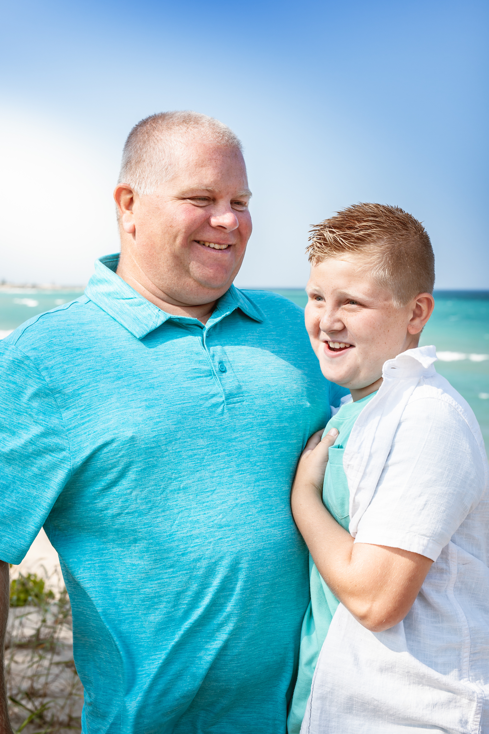 Father and child smiling