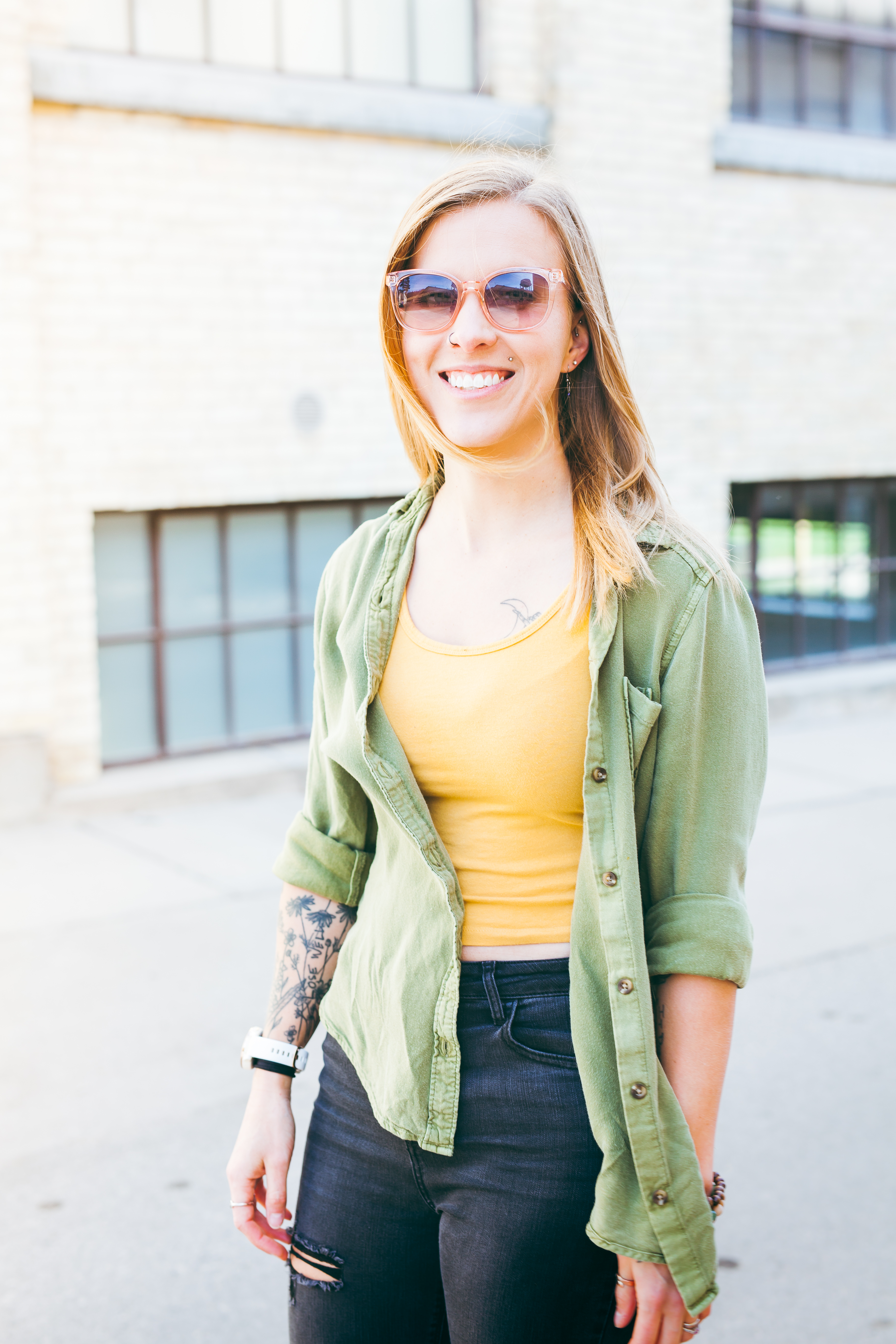 Woman smiling in sunglasses