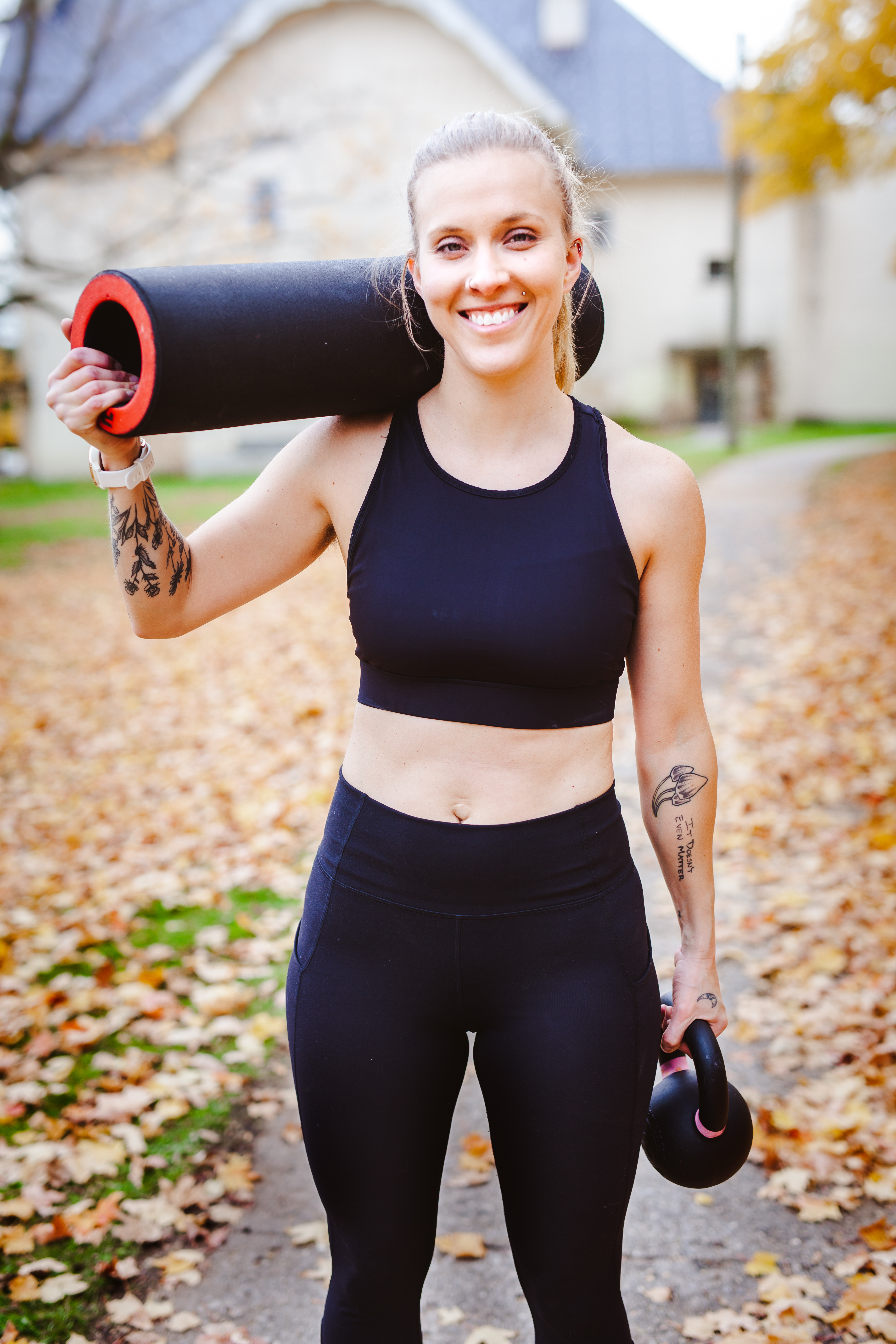 Woman posing with workout gear