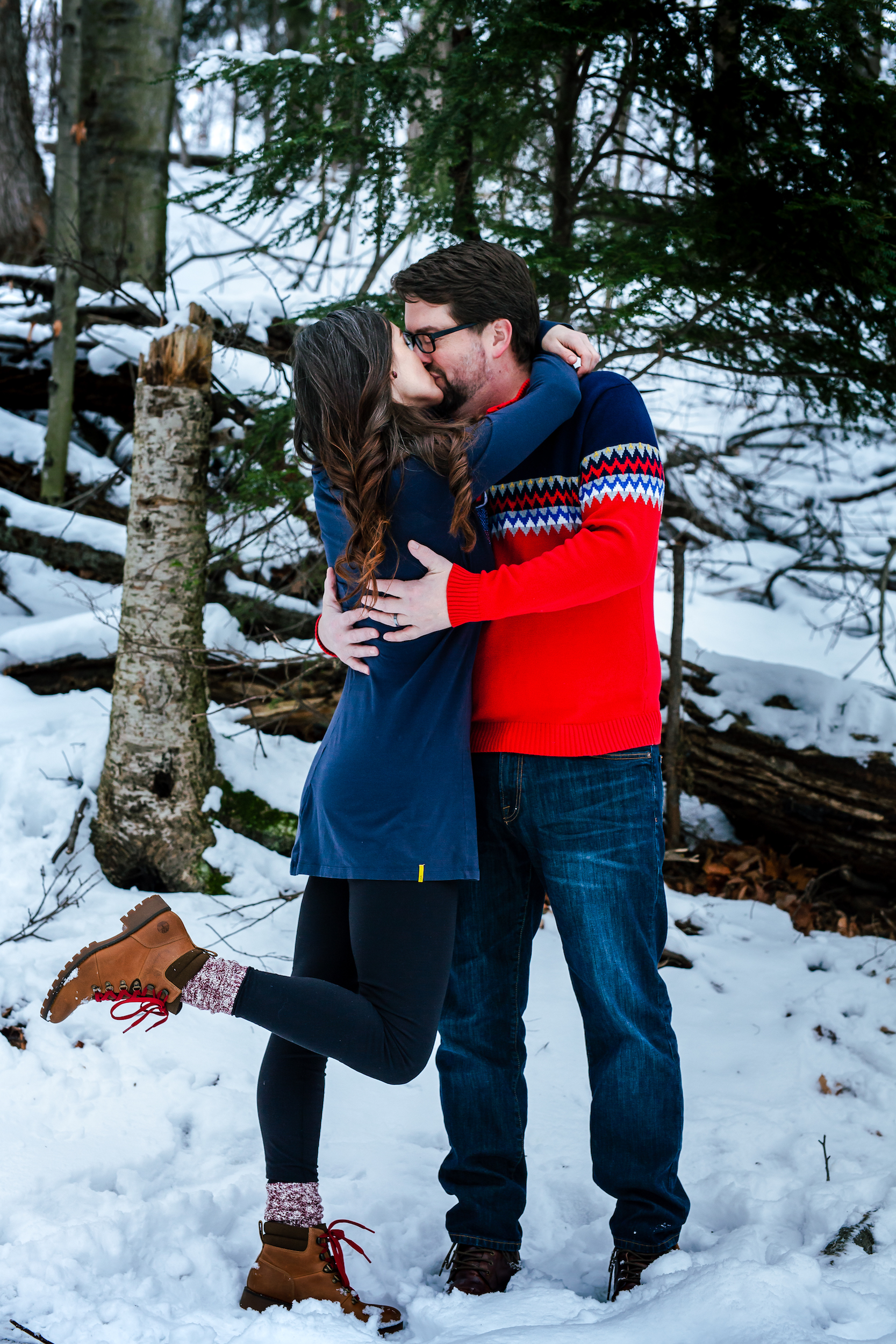 Couple kissing in the woods